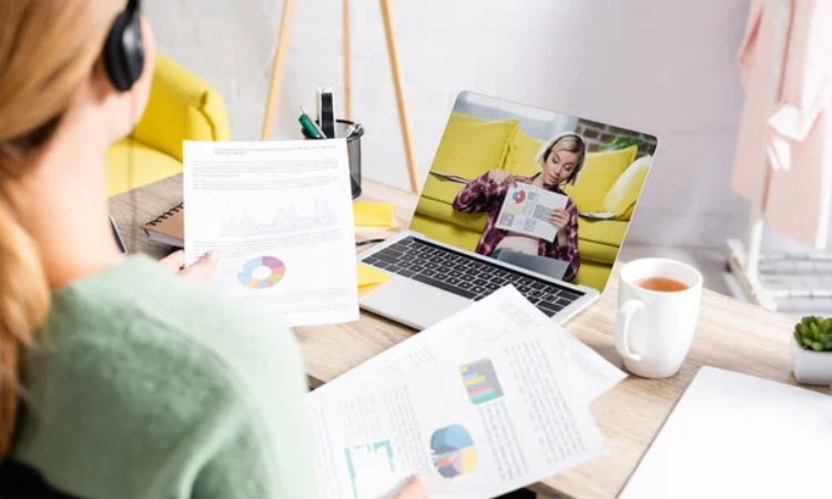 A worker watching a video to learn about their company