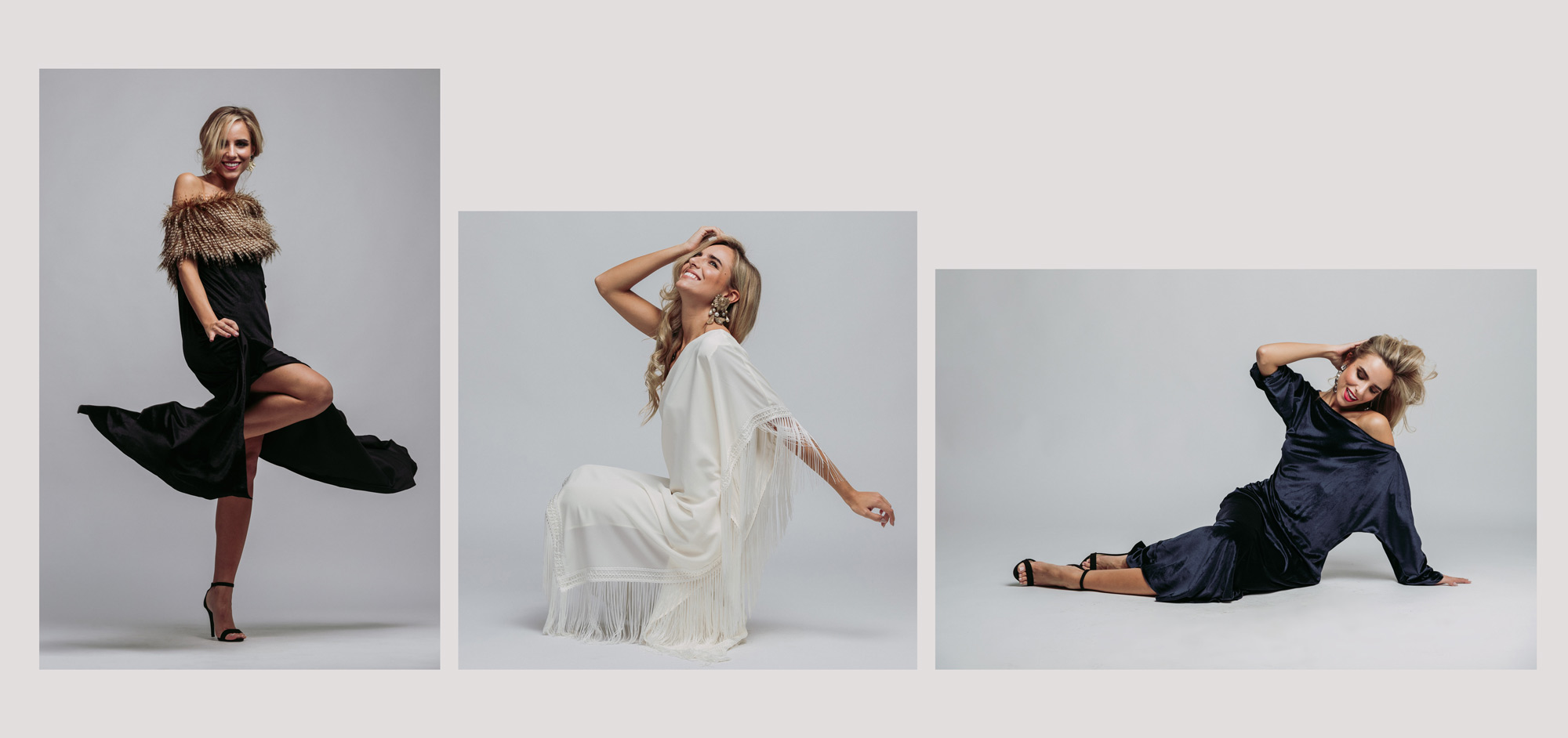 Mujeres posando en estudio; una de pie con vestido negro, otra sentada en blanco, otra en el suelo con vestido azul. Moda elegante.