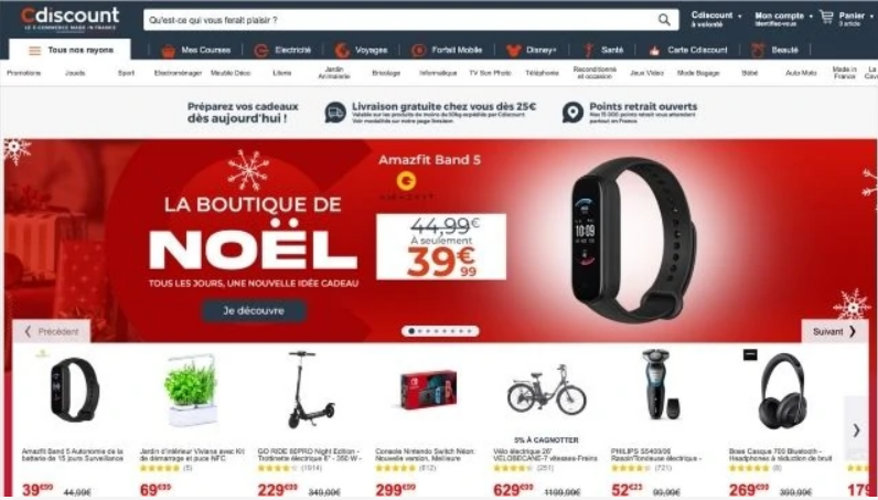 Reloj inteligente, destacado en un banner rojo festivo, promoviendo "La Boutique de No&euml;l". Ofertas especiales visibles en productos electr&oacute;nicos y gadgets.