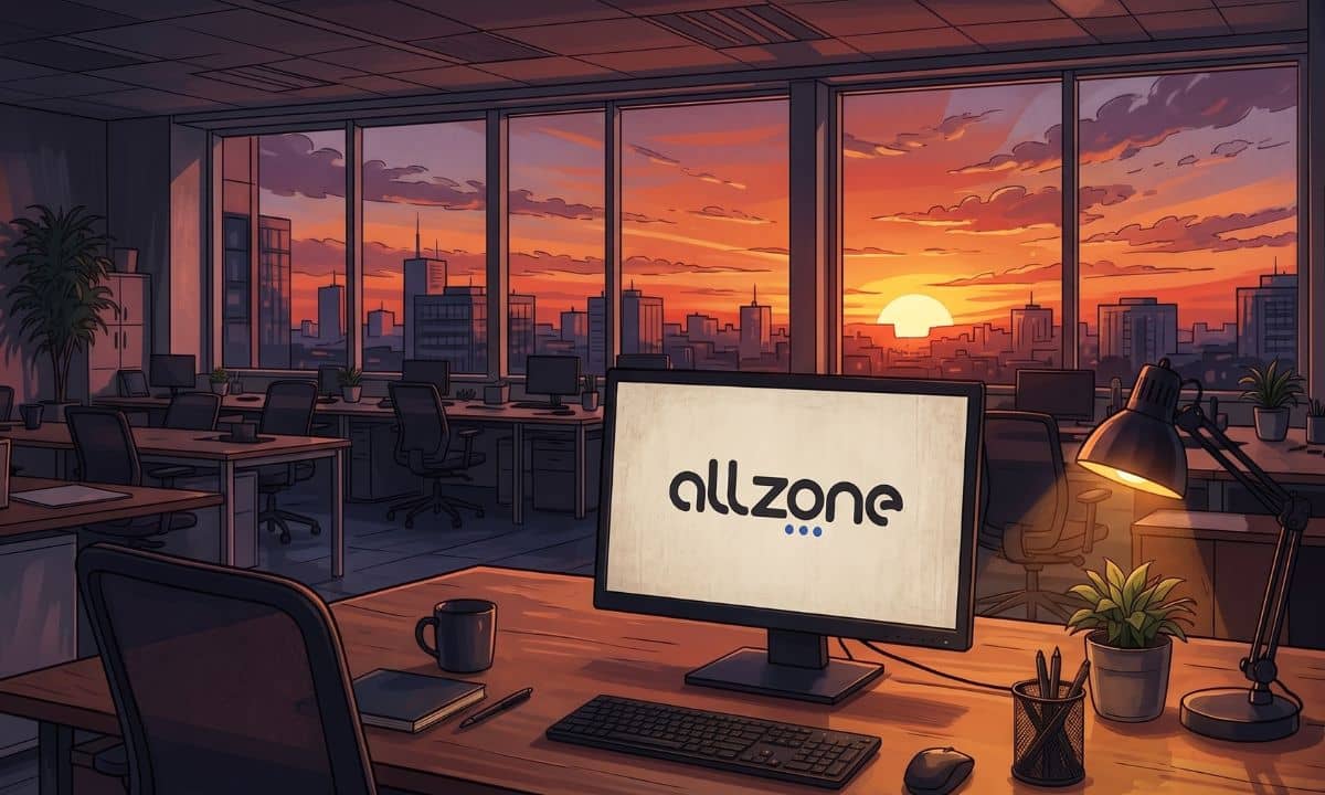 monitor con el logo de allzone en una oficina vacía con un atardecer al fondo